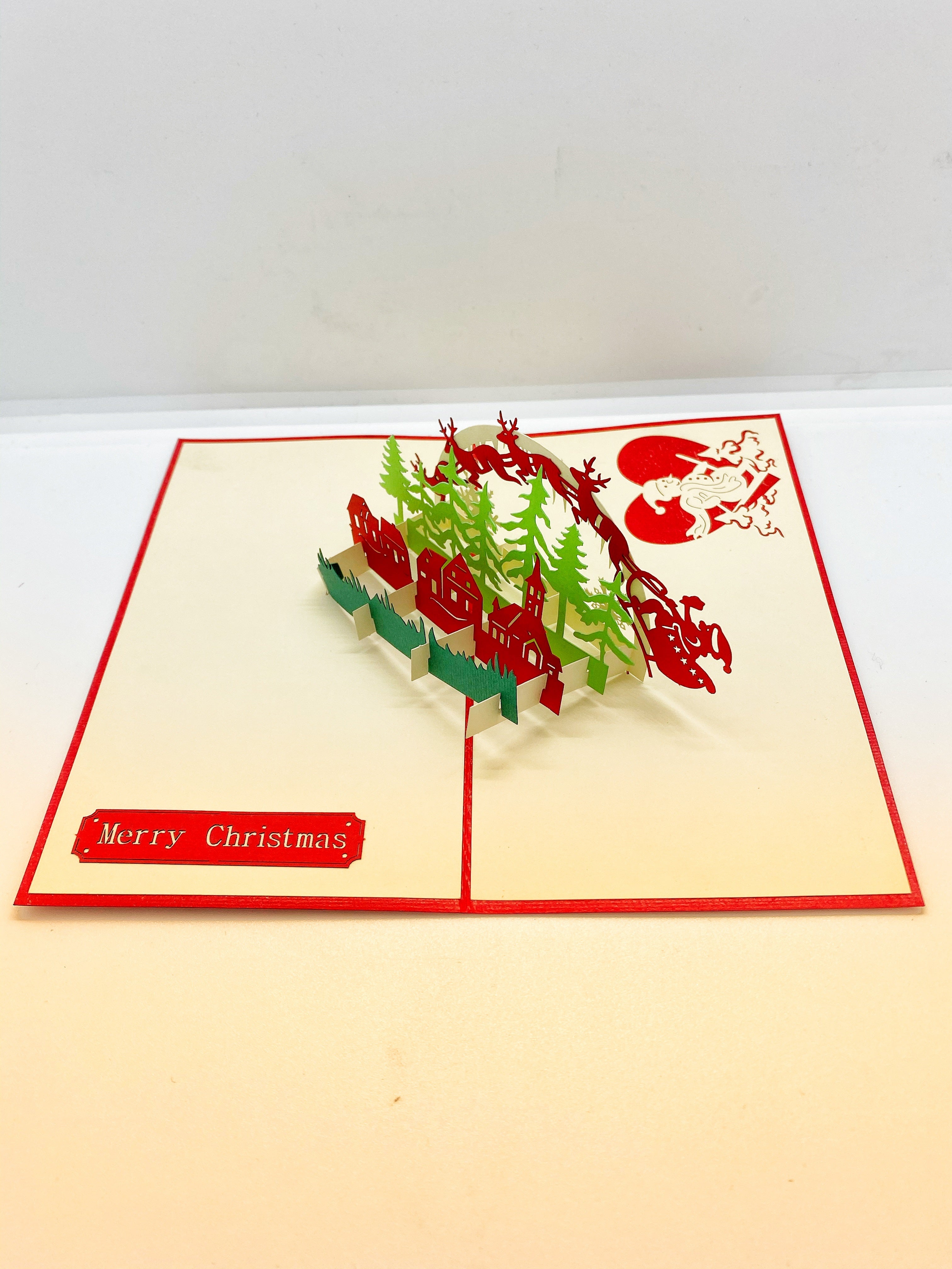 Pop-up Card _ Red Reindeer Flock with Santa Claus